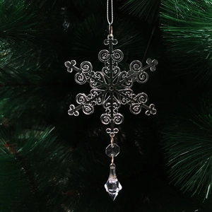 Sparkling crystal snowflake ornament with waterdrop pendant hanging on a Christmas tree