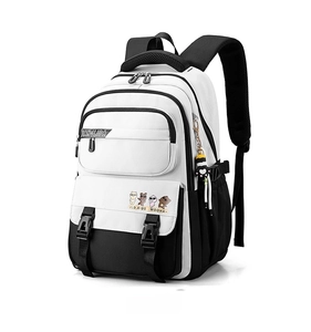 Detail view of black and white student backpack with multi-pocket design and charm