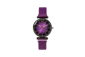 Detailed shot of elegant purple quartz watch featuring a faceted glass and magnetic mesh strap