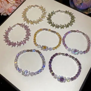 Exquisite flower zircon bracelets in multiple colors with white gold plating on display
