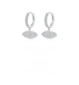 Macro detail of S925 sterling silver evil eye hoop earrings with sparkling white zircons