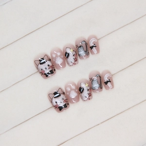Cat eye press-on nails with cute cartoon cat patterns and glitter pink finish