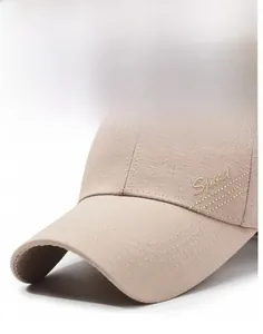Detail of khaki baseball cap with Sport embroidery and reinforced twill fabric texture