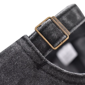 Macro detail of washed cotton baseball cap with adjustable antique bronze metal buckle