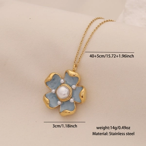 Detail showing blue flower pendant necklace size and weight specs on a textured surface