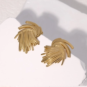 Vintage woven gold fan earrings in stainless steel on white stone background