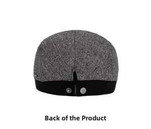 Close-up of the back of grey flat cap showing twill texture and metal snap button