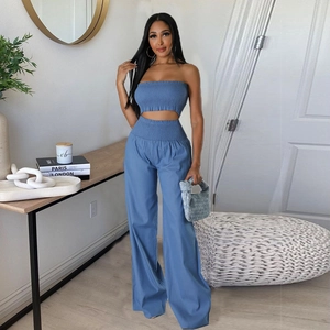 Women's chic blue two-piece set featuring cutout crop top and high-waist wide-leg pants