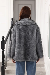 Back view of gray faux fur coat with long plush texture and waist belt detail