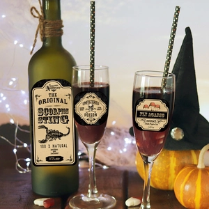 Detail of vintage Halloween potion labels on glass bottles with a spooky scorpion design