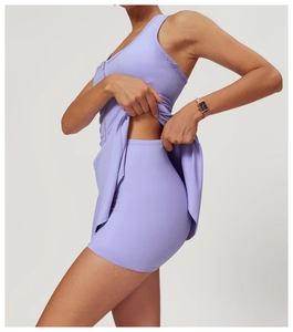 Detail showing lavender athletic dress with built-in safety shorts and front zipper