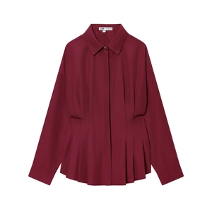 Detailed view of wine red blouse featuring waist ruching and elegant pleated accents