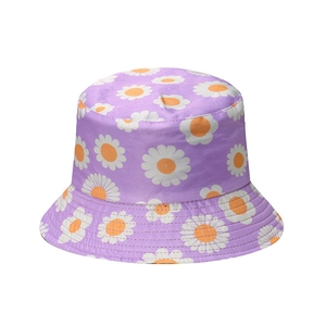 Light purple bucket hat with white daisy floral print for women on plain white background