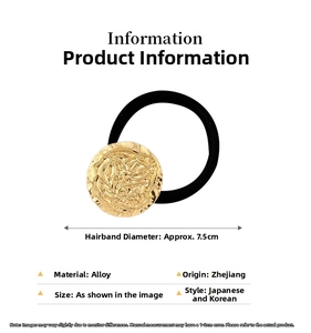 Detail eines goldenen, gehämmerten Legierung-Haargummis mit schwarzem elastischem Band
