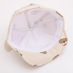 Detail of the corduroy baby hat with dog pattern and soft breathable cotton lining