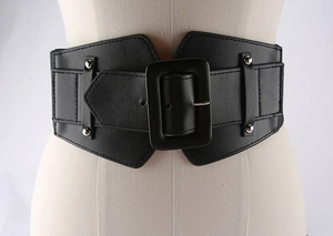 Close-up of black wide waist corset belt with square buckle and metal rivets