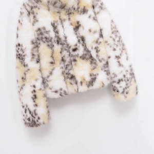 Chic women's faux fur coat with white gray and yellow spotted texture in a soft thick design