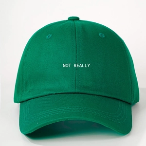 Dark green cotton baseball cap featuring white NOT REALLY embroidery and adjustable strap