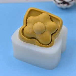 DIY silicone mold for egg toast flower crafts and handmade soap on blue background