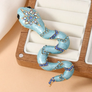 Vintage snake brooch in light blue enamel with gold plating and blue crystals