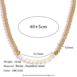 Beaded necklace featuring ten freshwater pearls and dark faceted crystals on 18K gold chain