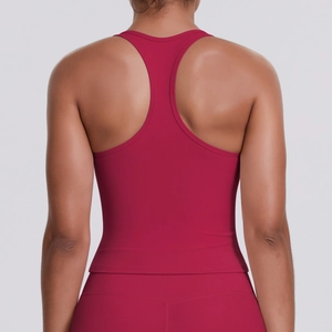 Close-up of racerback design on burgundy sports top with smooth seamless stitching