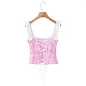 Detail of pink gingham tank top featuring lace trim and lace-up front design
