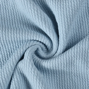 Macro shot of high-elastic light blue ribbed knit fabric texture and soft material detail
