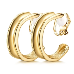 Detail of gold C-shaped clip-on earrings with polished exterior and textured inner surface