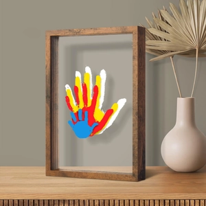 DIY wooden floating frame set with colorful family handprint art and acrylic panels