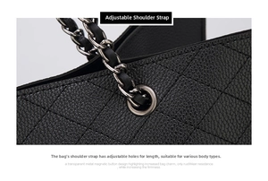 Detail of adjustable metal chain strap on black quilted faux leather crossbody bag