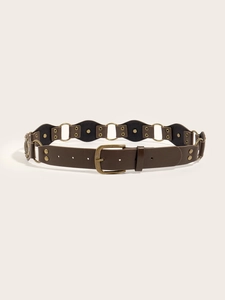 Detail of vintage PU leather belt featuring hollow round rings and brass rivet studs