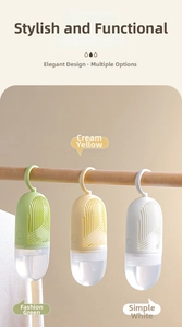 Close-up of hanging wardrobe dehumidifiers in green, yellow, and white colors