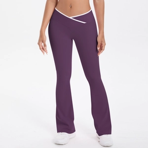 Detailed view of deep purple yoga pants with white trim and V-shaped crossover high waist