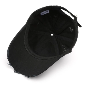 Retro washed black cotton baseball cap with distressed hole details and metal buckle