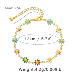 Detail view of colorful enamel daisy charms on 18K gold plated bracelet with dimensions