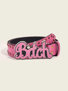Detail of pink studded belt featuring a large decorative golden Bitch letter buckle