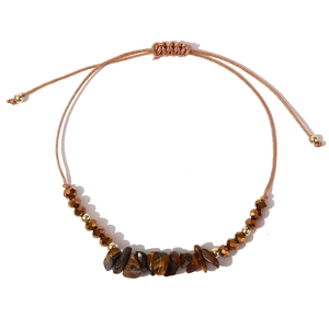 Close-up of adjustable woven bracelet with tiger eye stones and metallic beads