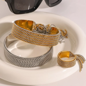Elegant stainless steel beaded bracelet and ring set with tassel details in gold and silver