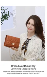 Close-up of brown quilted handbag with triangle embroidery and golden twist lock