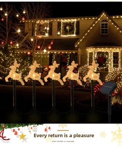 Outdoor solar reindeer lawn lights with warm LED glow for Christmas garden decoration