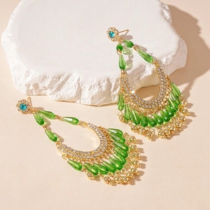 Vintage green crystal tassel drop earrings with gold floral accents and rhinestones