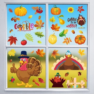 Detail of Thanksgiving window decals featuring cartoon turkey and autumn leaves on glass