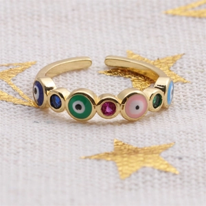 Bague ouverte œil maléfique dorée avec émail coloré et pierre rouge rubis