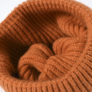 Winter thermal knit beanie in rust brown featuring thick ribbed texture and warm lining