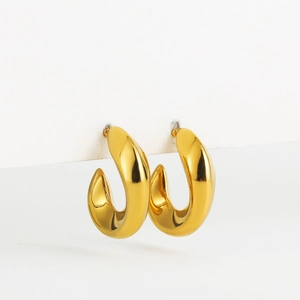 Close-up of 18K gold-plated stainless steel chunky hoop earrings with textured surface
