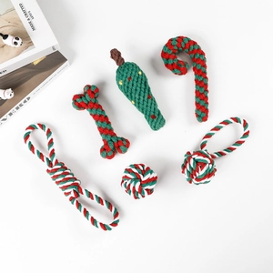Detail view of 6-piece Christmas dog cotton rope toy set in festive red, green and white colors