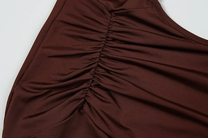 Close-up detail of the center ruched design on this dark brown slim fit dress