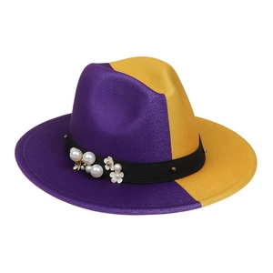 Detail of purple and yellow two-tone fedora hat featuring pearl and flower embellishments