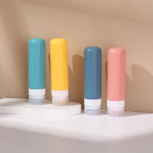 Set of four 100ml silicone travel bottles in assorted colors for toiletries and liquids